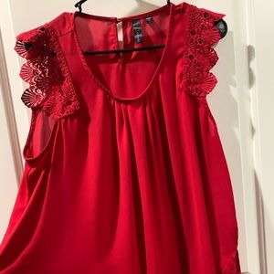 Plus size sheer top with lace detail on shoulder